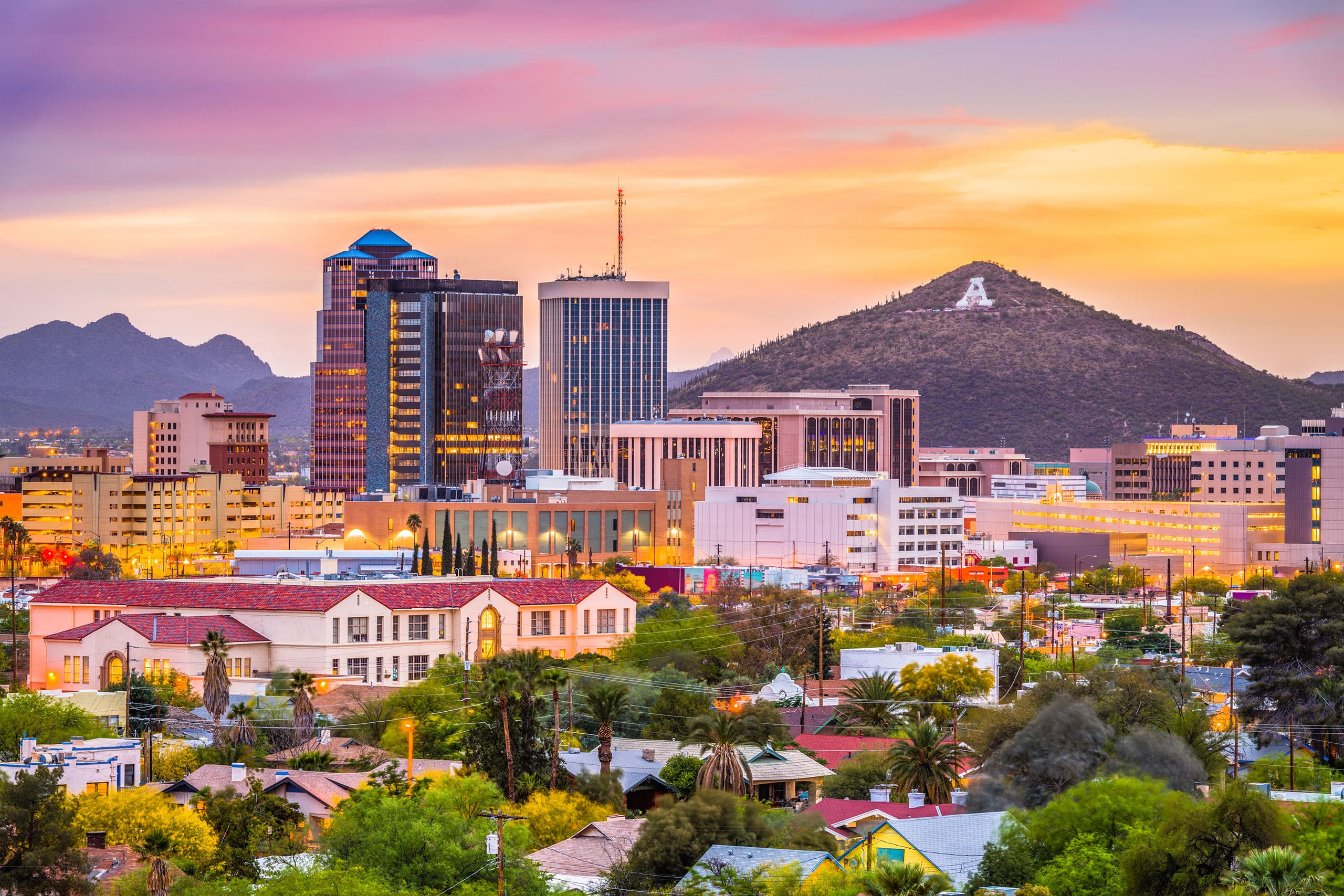 Tucson skyline at sunset with A Mountain in view, one of three cities Trusting Connections serves